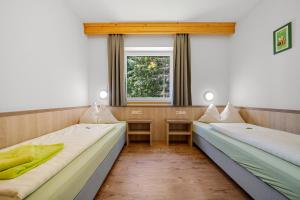 Ένα ή περισσότερα κρεβάτια σε δωμάτιο στο Hotel Ramsaueralm