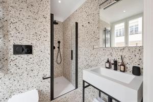 a bathroom with a sink and a mirror at The Rubens Collection in Rome