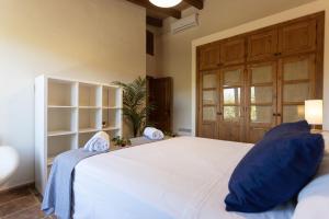 Ein Bett oder Betten in einem Zimmer der Unterkunft Finca Sa Tanqueta Rústica