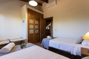 Ein Bett oder Betten in einem Zimmer der Unterkunft Finca Sa Tanqueta Rústica
