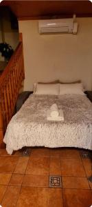 A bed or beds in a room at Raco de Lis