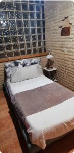 A bed or beds in a room at Raco de Lis