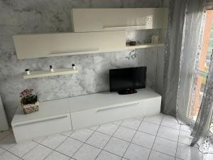 TV a/nebo společenská místnost v ubytování Casa Ilaria