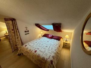 a bedroom with a bed and a large mirror at Appartement rénové avec Multi Pass offert, proche du centre du village ! - FR-1-692-13 in Abondance