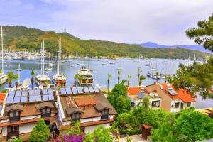 a view of a marina with boats in the water at Mykonut Boutique Suites in Fethiye
