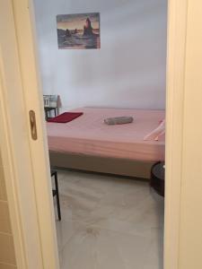 a bedroom with a bed and a picture on the wall at Classical beauty near Acropolis! in Athens