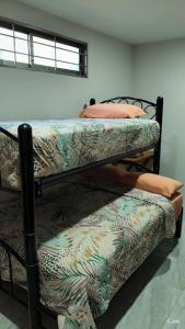 two bunk beds sitting in a room with at Departamento bonito en Santiago Etla in San Sebastián Etla +14 photos