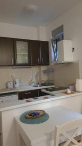 a kitchen with a table with a plate on it at Apartman BelLe in Belgrade +8 photos