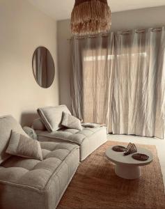 Posezení v ubytování L'essentiel Home By Chloé
