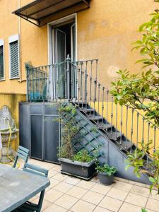 a staircase leading up to a building with plants at Spazio Prestige in Milan +18 photos