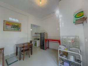 a small kitchen with a table and a refrigerator at Surya Ubud View and Suites by EPS in Ubud +24 photos