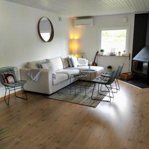 a living room with a white couch and chairs at Stunning Home In Tvååker With 2 Bedrooms And Sauna in Tvååker +15 photos