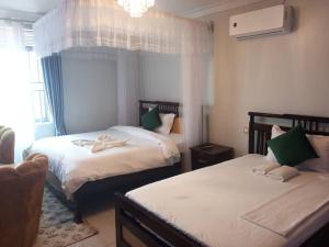 Tina Ma Hotel客房内的一张或多张床位