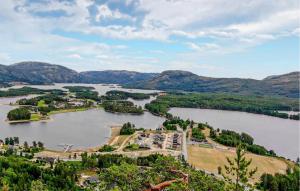 an aerial view of a lake with mountains in the background at 4 Bedroom Stunning Home In Vrådal in Vradal