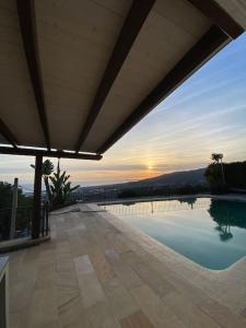 a view of a swimming pool from a house at House Seaviews Barcelona 22Km in Cabrils