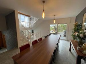 a large dining room with a long table and chairs at House Seaviews Barcelona 22Km in Cabrils