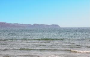 a large body of water with mountains in the background at Awesome Home In Sant Miquel De Fluvià in San Miguel de Fluviá +22 photos