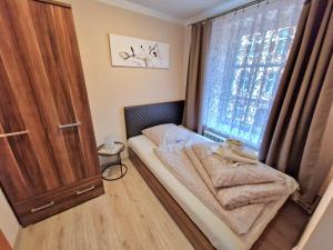 Posteľ alebo postele v izbe v ubytovaní ApartHouse Apartamenty Centrum - In the city center Near the train station