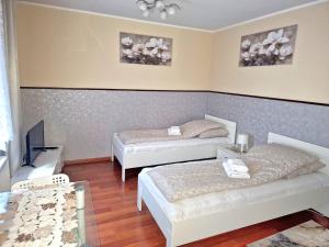 Posteľ alebo postele v izbe v ubytovaní ApartHouse Apartamenty Centrum - In the city center Near the train station