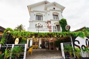 a building with a sign that reads sophium at Solo Inn By Hawk Hospitality in Cochin