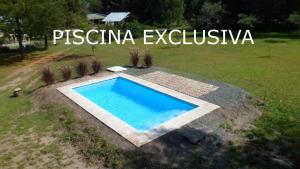 an overhead view of a swimming pool in a yard at La Casita del Vivero in Casa Grande