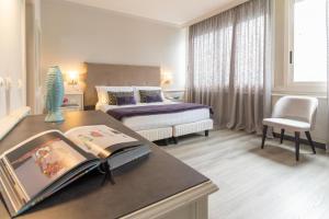 Lova arba lovos apgyvendinimo įstaigoje Parco dei Principi Boutique Hotel
