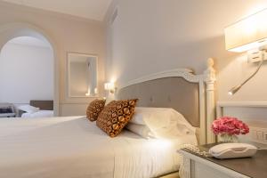Lova arba lovos apgyvendinimo įstaigoje Parco dei Principi Boutique Hotel