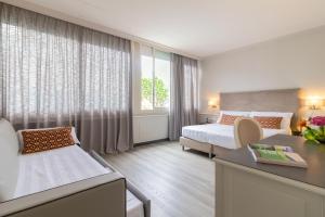 Lova arba lovos apgyvendinimo įstaigoje Parco dei Principi Boutique Hotel