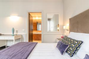 Lova arba lovos apgyvendinimo įstaigoje Parco dei Principi Boutique Hotel