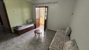 a room with a couch and a chair and a table at Villa SAAD in Khenchela
