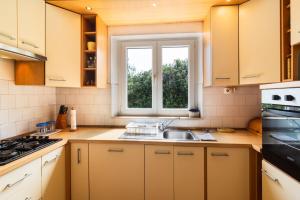 a kitchen with a sink and a window at Apartment Ivope in Splitska