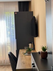 TV a/nebo společenská místnost v ubytování Midtown Prishtina Stays