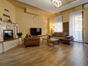 TV a/nebo společenská místnost v ubytování Midtown Prishtina Stays