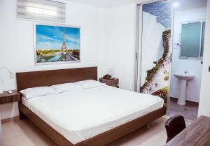 Postel nebo postele na pokoji v ubytování Hotel Suites Caribe