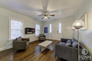 a living room with a couch and a ceiling fan at Relaxing Retreat in Memphis Apartment in Memphis