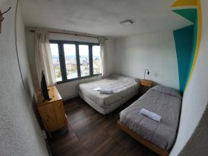 Postel nebo postele na pokoji v ubytování Temiscira Hostel