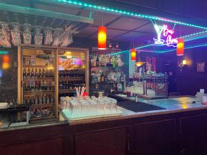 a bar with a counter with glasses of alcohol at Outlook Motor Hotel in Outlook