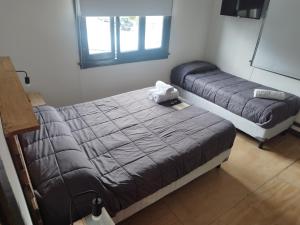 Postel nebo postele na pokoji v ubytování Temiscira Hostel