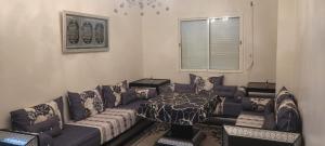a living room with a couch and a bed at Tanger in Tangier