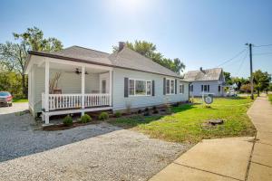 a white house with a porch and a driveway at Vino Villa Wine Country Gem Patio and Grill in Defiance