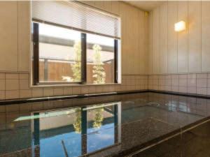 a swimming pool in a room with a window at Racine Home Harie - Vacation STAY 06978v in Takashima