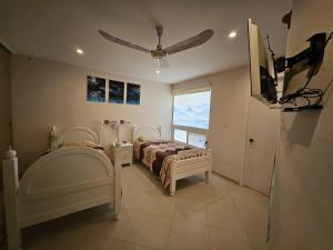 Ένα ή περισσότερα κρεβάτια σε δωμάτιο στο Habitación en departamento