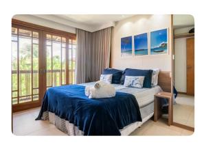 Ένα ή περισσότερα κρεβάτια σε δωμάτιο στο Comodidade, conforto e charme, á beira mar! +33 φωτογραφίες