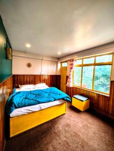 a bedroom with a large bed in a boat at Hidden Monkey Stays Darjeeling, Batasia in Darjeeling