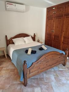 a bedroom with a large bed with two towels on it at Casa Estrella in Almería +20 photos