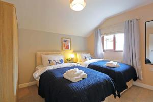 Ένα ή περισσότερα κρεβάτια σε δωμάτιο στο 11 beds, 2 properties combined, M1, M62, Free parking