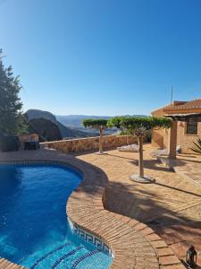 a swimming pool with a view of the mountains at Casa Estrella in Almería