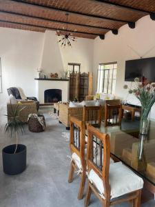 a living room with chairs and a fireplace at Casa Moly in Guanajuato +10 photos