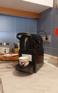 a toaster sitting on a kitchen counter with a bowl at Il Girasole in Milan