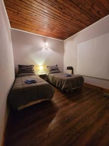 Ένα ή περισσότερα κρεβάτια σε δωμάτιο στο Departamento Castello